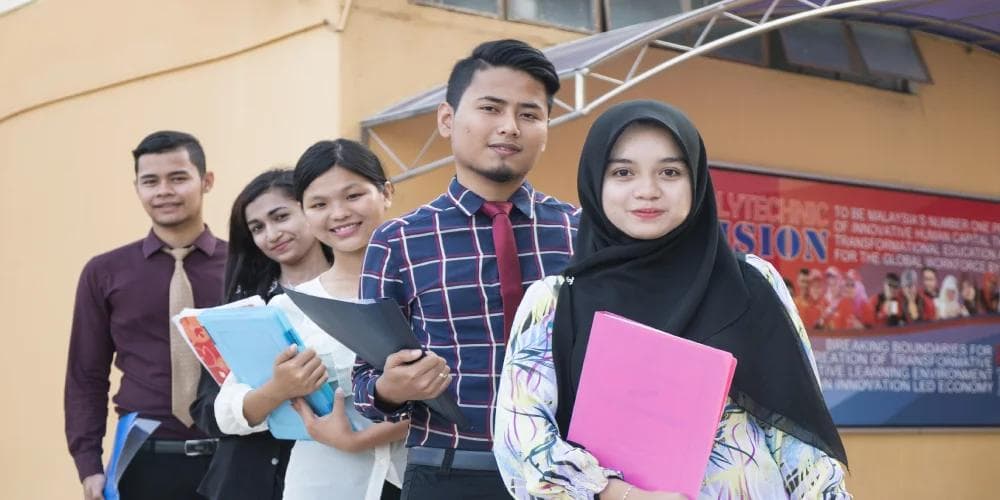Group of students holding books and folders, symbolising career planning, education, and Bazi analysis for future success.