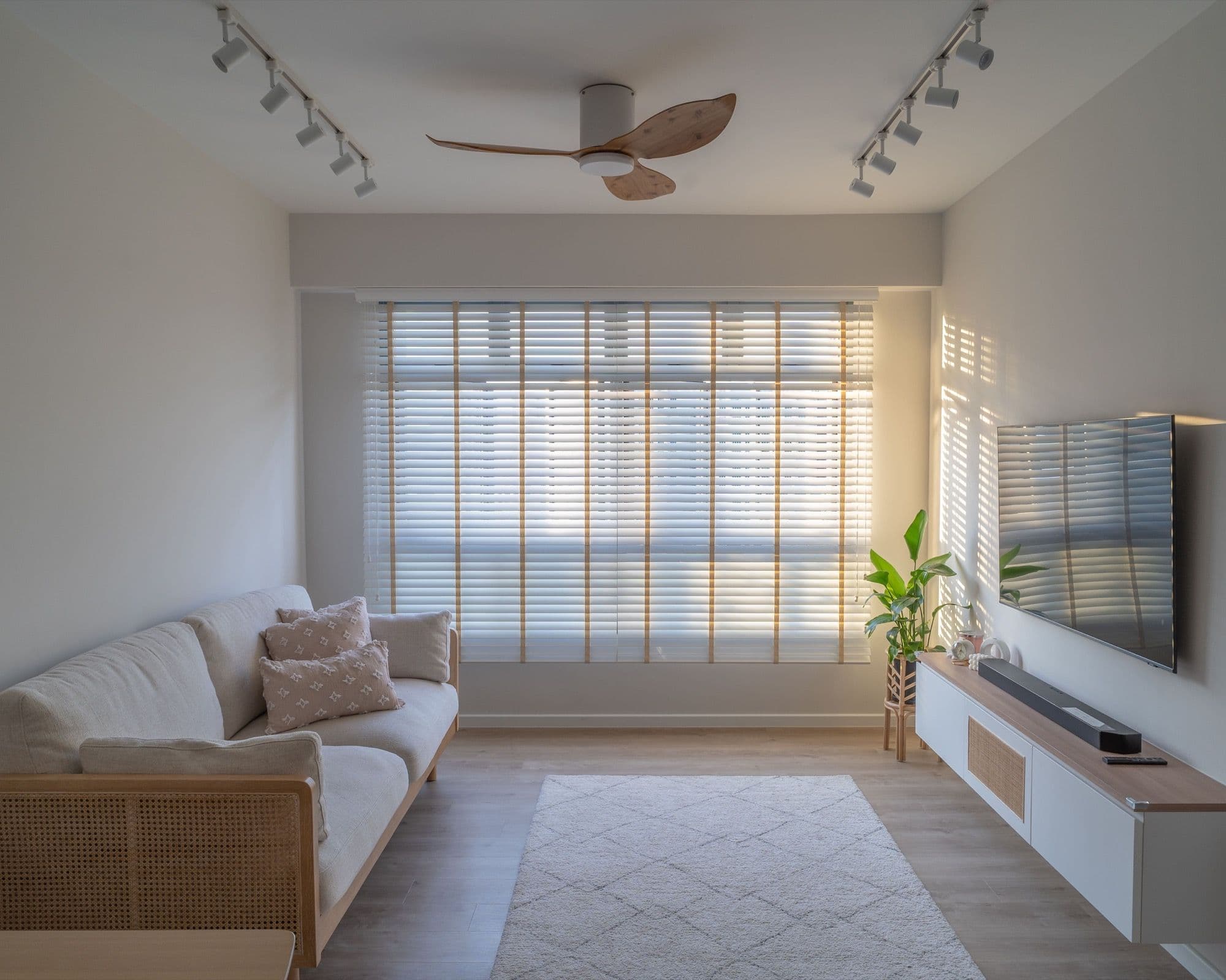 A scandinavian minimalist HDB interior with a plant