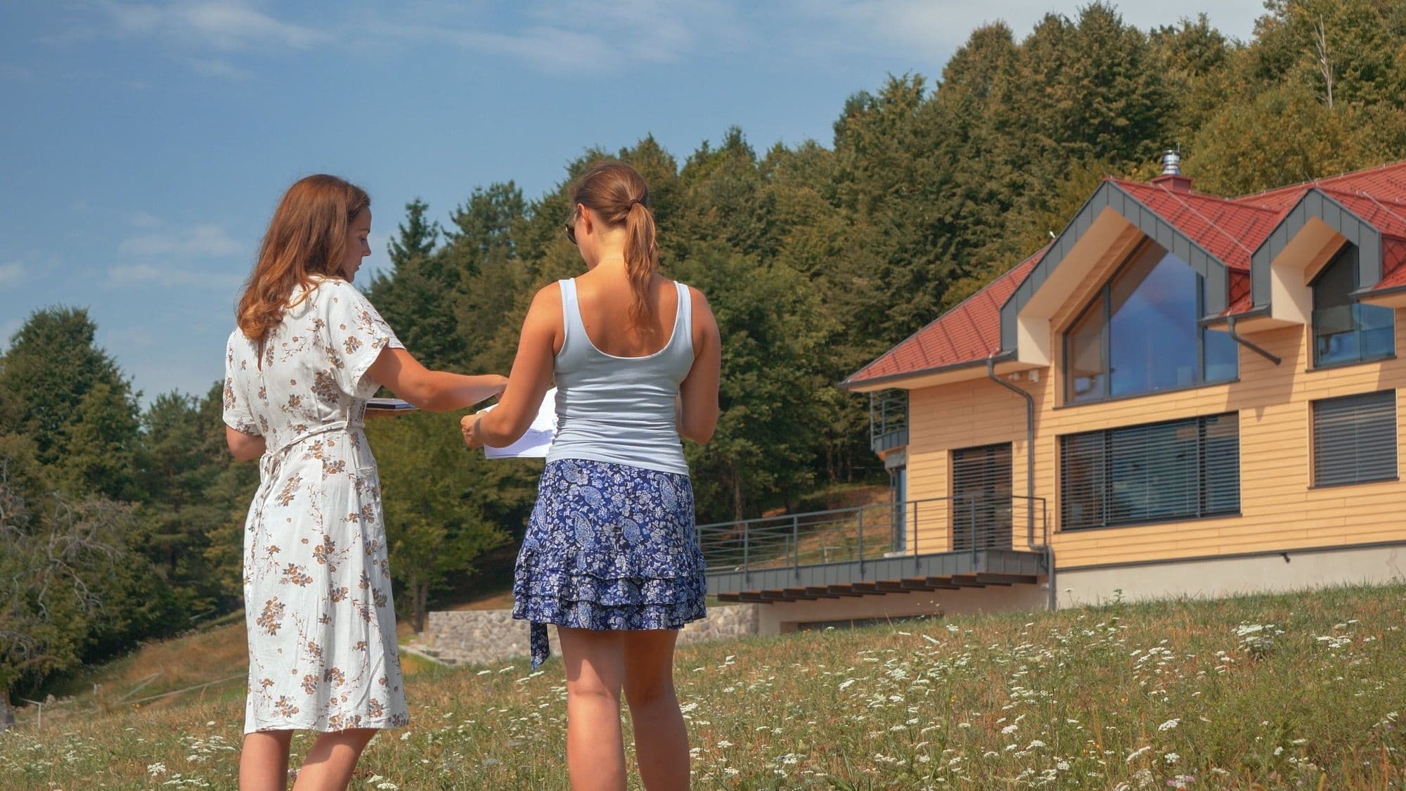 A lady consulting with a feng shui expert on the layout of her home